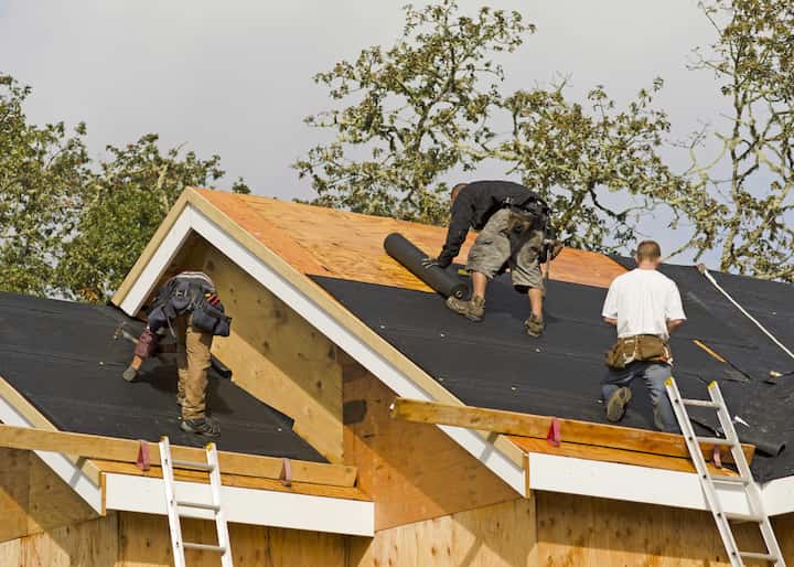 Roofing repair experts working on a residential home in Pasadena, CA.
